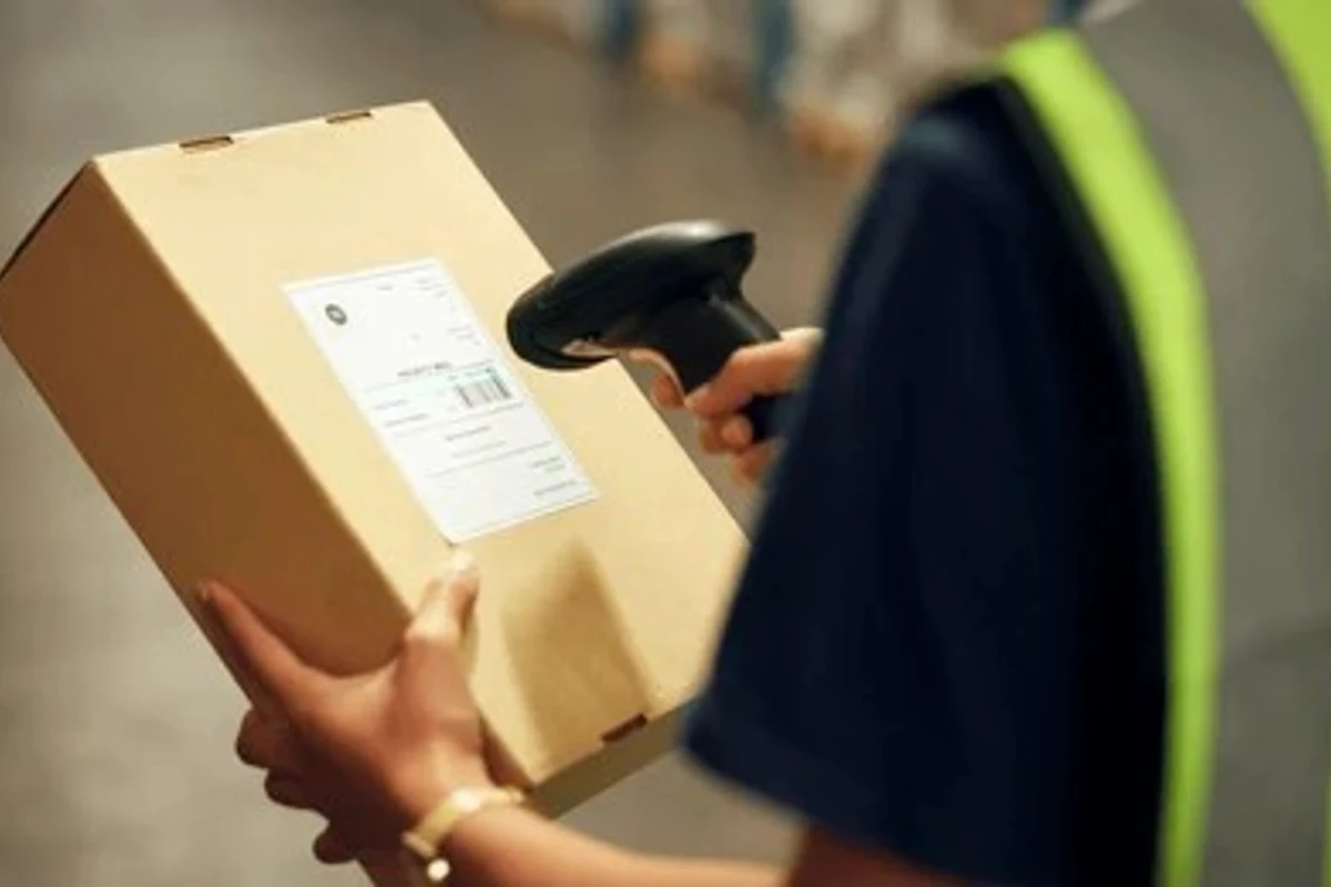 V Mailbox staff scanning mail contents — open and scan service Canada